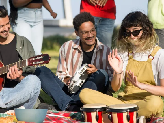 group of people playing musical instruments outside