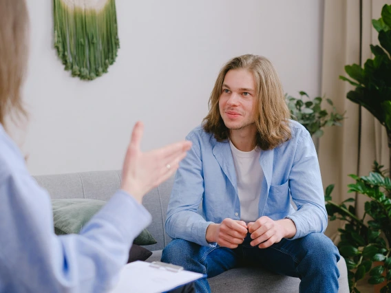 person looking at someone outside of the frame and smiling