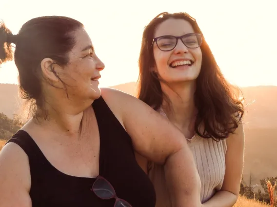 two women walking and laughing