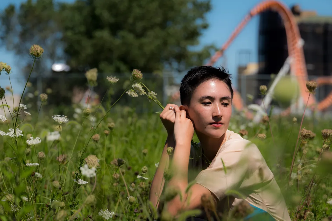 person sitting in the grass