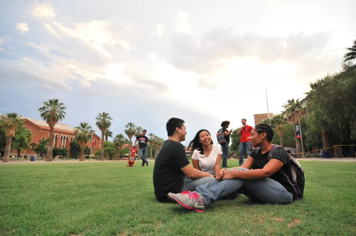 Group of students sitting and talking on the UA Mall