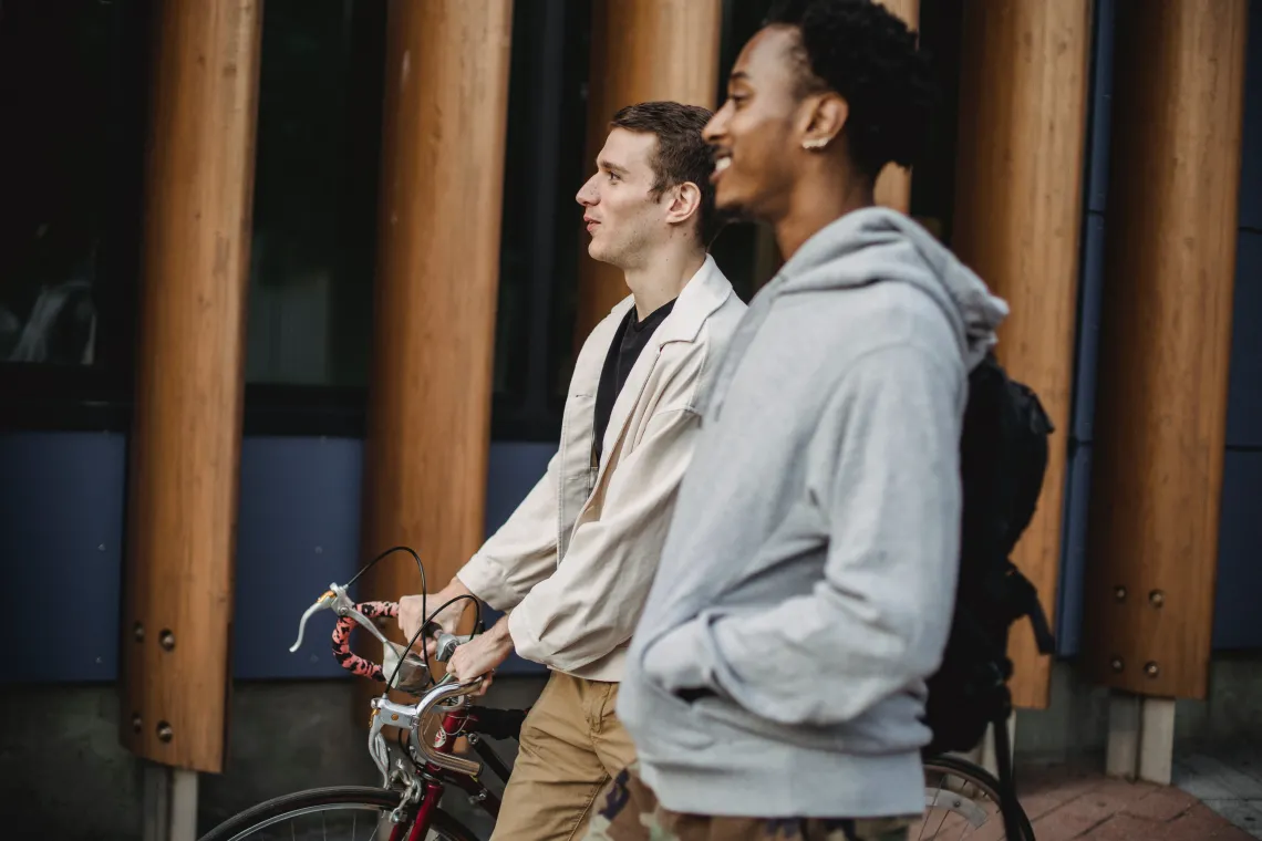 two people walking and talking