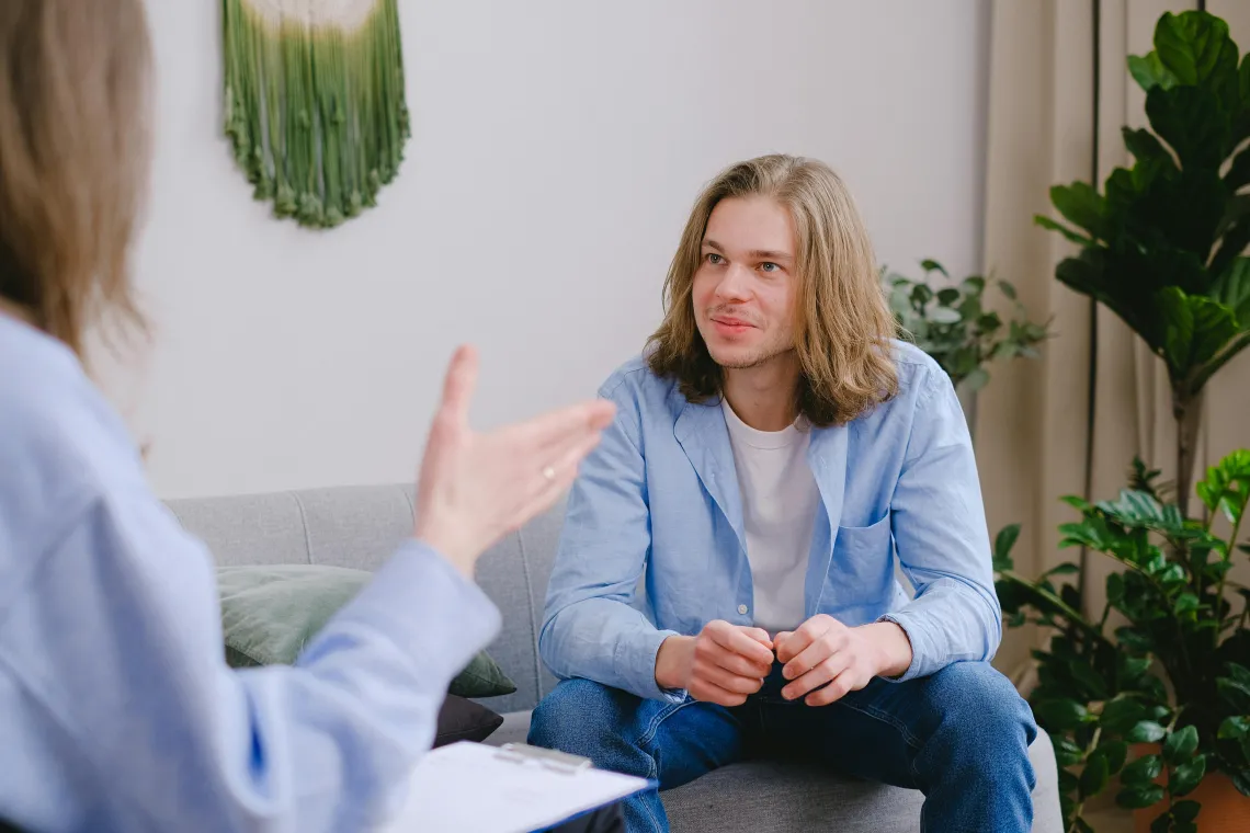 person looking at someone outside of the frame and smiling