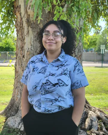 person standing in front of a tree