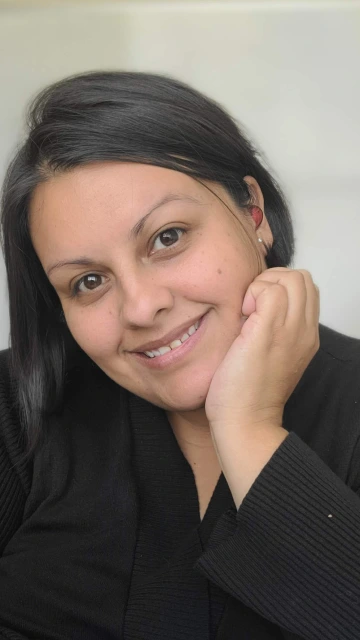 headshot of a woman wearing black