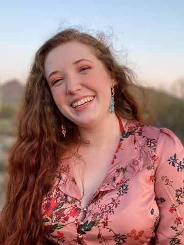 headshot of a woman outside